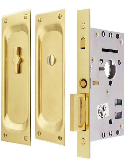Pocket Door Mortise Lock Set With Rectangular Pulls in Polished Brass.